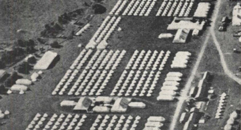 Aerial photograph of a military encampment laid out in rows.